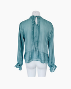 Blusa de gasa manga larga con bobos celeste